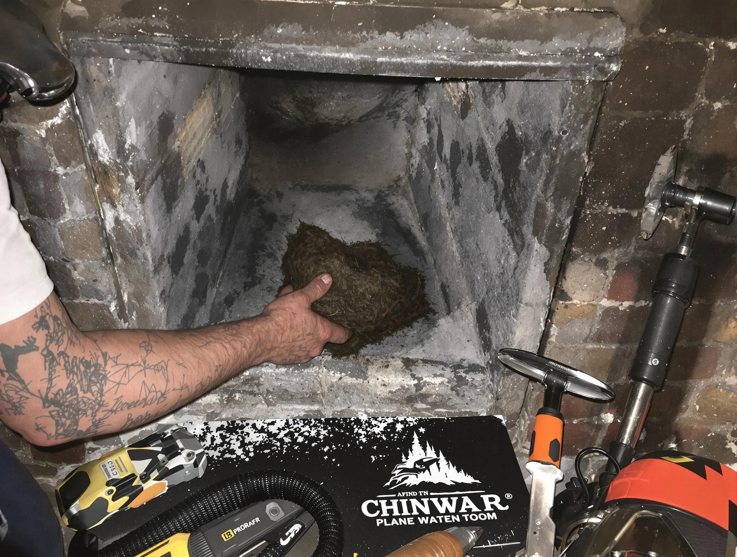 Springfield Chimney Sweep safely removing debris and screening chimney in Springfield, TN